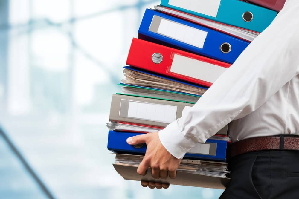 Streamlining tax documentation with Konsise: A guide for tax professionals 2 man holding tax records